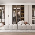Modern Walk in Closet Interior With White Cabinets Hanging Clothes And Upholstered Bench