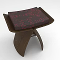 Wooden Stool With Red Patterned Cushion And Modern Curved Leg Design