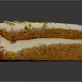 Moist Layered Creamy Cake Slice Topped With Crunchy Pumpkin Seeds