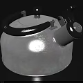 Silver Stainless Steel Kettle With Black Handle And Modern Boiling Design