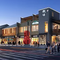 Vibrant Commercial Street With Red Violin Sculpture Lively Shops And Pedestrians At Dusk