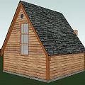 Wooden Hotel Building Featuring Gabled Roof Black Shingles Open Door Small Window Green Grass Deck