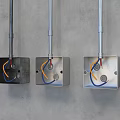 Switch Panels Black and Silver with Yellow and Blue Wires Mounted on Grey Wall