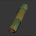 Carved Sculpture With Green And Yellow Long Bamboo Like Segments On Dark Background With Reflection