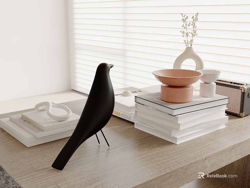 Black Inflatable Bird Ornament On Wooden Table With Stacked Books Bowls And White Blinds 3d model 