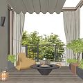 Cozy Home Balcony Interior With Wicker Chair Round Fire Pit Table And Green Plants