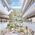 Bright Shopping Mall Atrium With Multi Level Floors Escalators Green Plants And Shoppers
