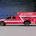 Red Fire Department Emergency Truck Towing Rescue Boat In Industrial Warehouse