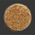 Round Layered Cake With Golden Crumbles And Cream Filling On Dark Background