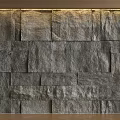 Textured Stone Bed Background Wall In Modern Interior With Warm Lighting