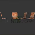 Green Round Outdoor Table With Four Wrought Iron Chairs And Orange Striped Cushions
