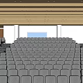 Spacious Tiered Conference Room With Rows Of Gray Seats And Large Windows