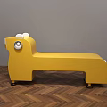Yellow Animal Shaped Public Chair With Ears Eyes And Wheels On Wooden Floor