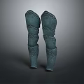 Ancient Bronze Leg Armor With Intricate Carved Patterns And Symmetrical Design