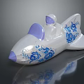 White Airplane Shaped Decorative Ornament With Blue Floral Patterns Purple Seat And Small Pilot Figure