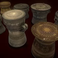 Traditional Musical Drums With Artistic Paintings Carved Patterns And Various Sizes In Brown Gray Tones