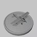 White And Yellow Model Airplane With Black Crosses On Round Gray Base