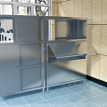 Modern Cafeteria Interior With Stainless Steel Counters Storage Cabinets And Tile Walls