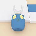 Blue Kids Electric Toothbrush With Cute Animal Design Yellow Eyes And White U Shaped Head