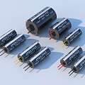 Various Electronic Capacitors In Array With Different Sizes And Colored Leads 3d model