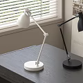 White And Black Modern Desk Lamps On Dark Table Near Window Blinds
