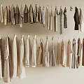Hanging Clothes in Various Styles with Neutral Tones Neatly Arranged on Wall Hangers