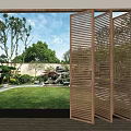 Wooden Open Folding Door Revealing Garden Landscape With Lawn Trees And Rocks