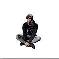 Man Sitting On The Ground Wearing Black Hoodie With Design Gray Beanie And White Pants