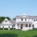 White Single Family House With Gray Roof Green Lawn And Porch Trees