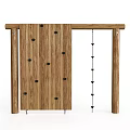 Wooden Playground Equipment Featuring Climbing Wall With Black Holds And Hanging Rope For Kids