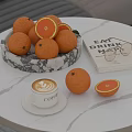 Fresh Oranges In Marble Bowl On White Marble Table With Coffee Cup And Book