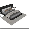 Elegant Double Bed with Black Leather Headboard Pillows Blanket Side Tables and Rug