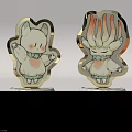 Two Different Monster Cartoon Figurines With Metallic Finish And MONSTER Bases