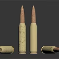 Brass Bullets Displayed On Black Reflective Surface In Standing And Lying Positions