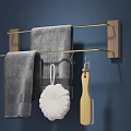 Wooden Frame Bathroom Rack With Golden Metal Bars Gray Towels White Soap And Wooden Brush