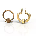 Two Ring Shaped Carved Metal Sculptures In Copper And Gold Tones