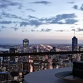 Modern Home Balcony With Glass Railing City Night View Sea View And Warm Lighting