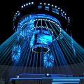Night Illuminated Architectural Structure With Blue Radial Beams And Firework Decorations