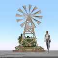 Windmill Shaped Floral Installation with Colorful Flowers and Green Plants for Outdoor Decor