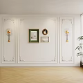 Ornate White Background Wall with Decorative Moldings Framed Artworks Round Mirror and Wall Sconces