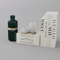 Artistic Decorative Ornament Set Featuring Green Bottle White Cylinders And Art Books