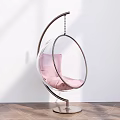 Stylish Transparent Spherical Hanging Chair With Pink Cushion Metal Stand White Wall And Wooden Floor