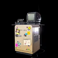 Vintage CRT Television Placed on a Cabinet with Colorful Stickers and Decorations