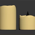 Set Of Three Cream Colored Household Candles With Various Shapes And Wicks