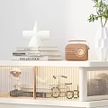 White Chest of Drawers with Books Potted Plant and Decor in Modern Indoor Space