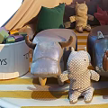 Stuffed Plush Dolls Inside Teepee Tent With String Lights Striped Rug And Boys Toys Bucket