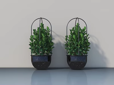 Two Green Potted Plants in Black Spotted Pots With Metal Frames Against Light Gray Wall 3d model