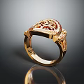 Elegant Gold Ring With Intricate Filigree Design And Red Gemstone Centerpiece