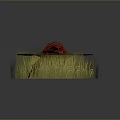 Red Flower Shaped Object With Wings Placed On Green Grass Area