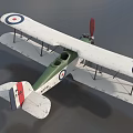 Vintage Biplane Fighter Model with Green Body Red Propeller and Wing Roundels